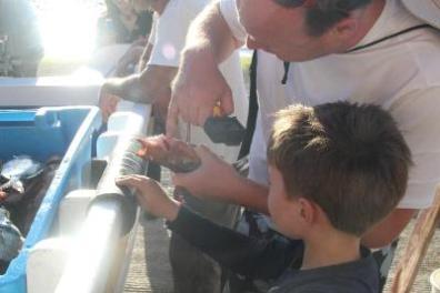 Man explaining to a little boy