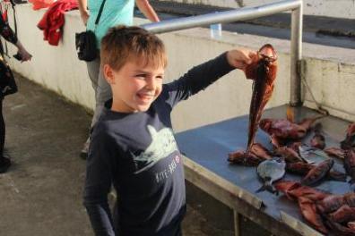 Little Boy showing a fish